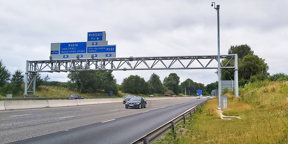 Smart Motorway gantry with 'surveillance' camera looking right at us